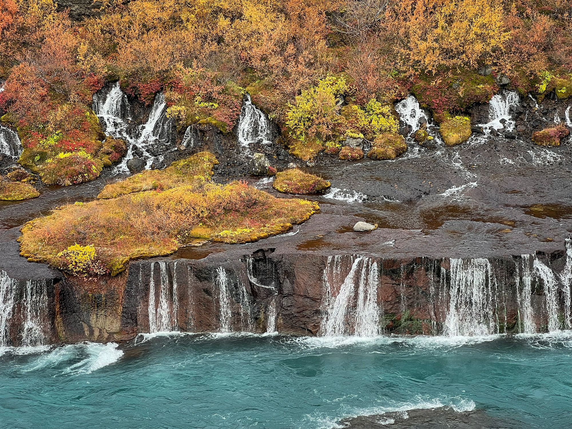 West Iceland - two unusual waterfalls framed in autumn gold