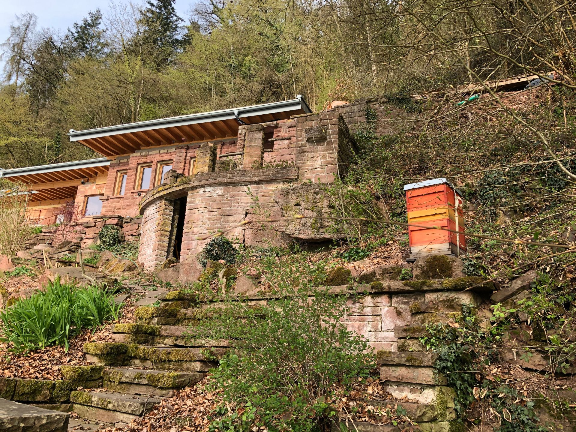 Weekend house build with red sandstone with beehive
