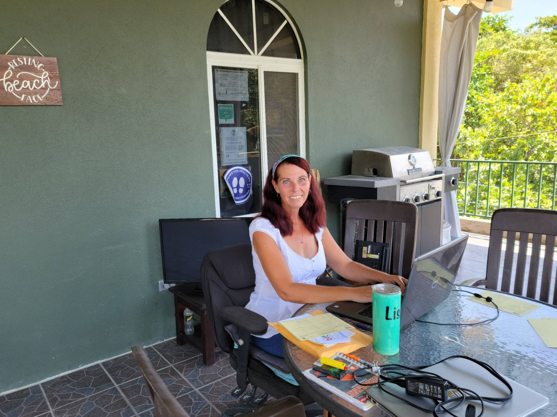 Lisa hard at work in her favorite location, the balcony office!