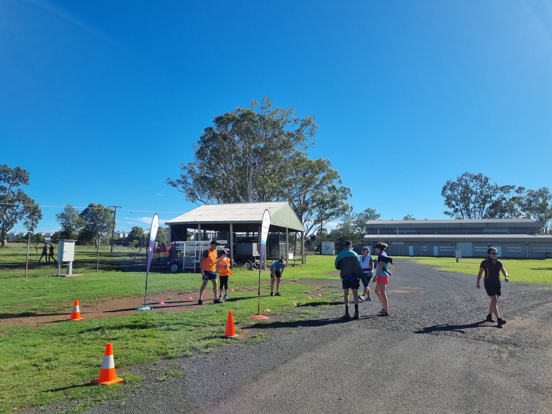 Me, at the finish line, talking to Wayne and Jo: two of the key volunteers keeping Pittsworth parkrun happening each week.