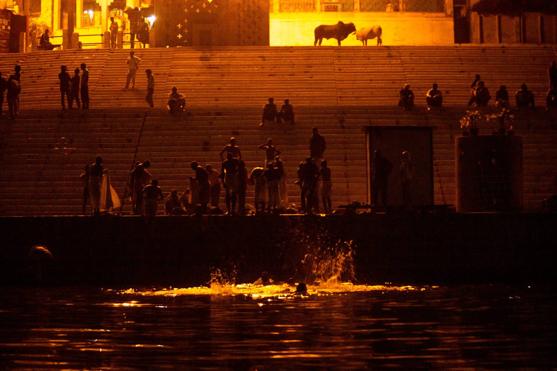 Indian Tourists take a spiritual dip in the Ganges.