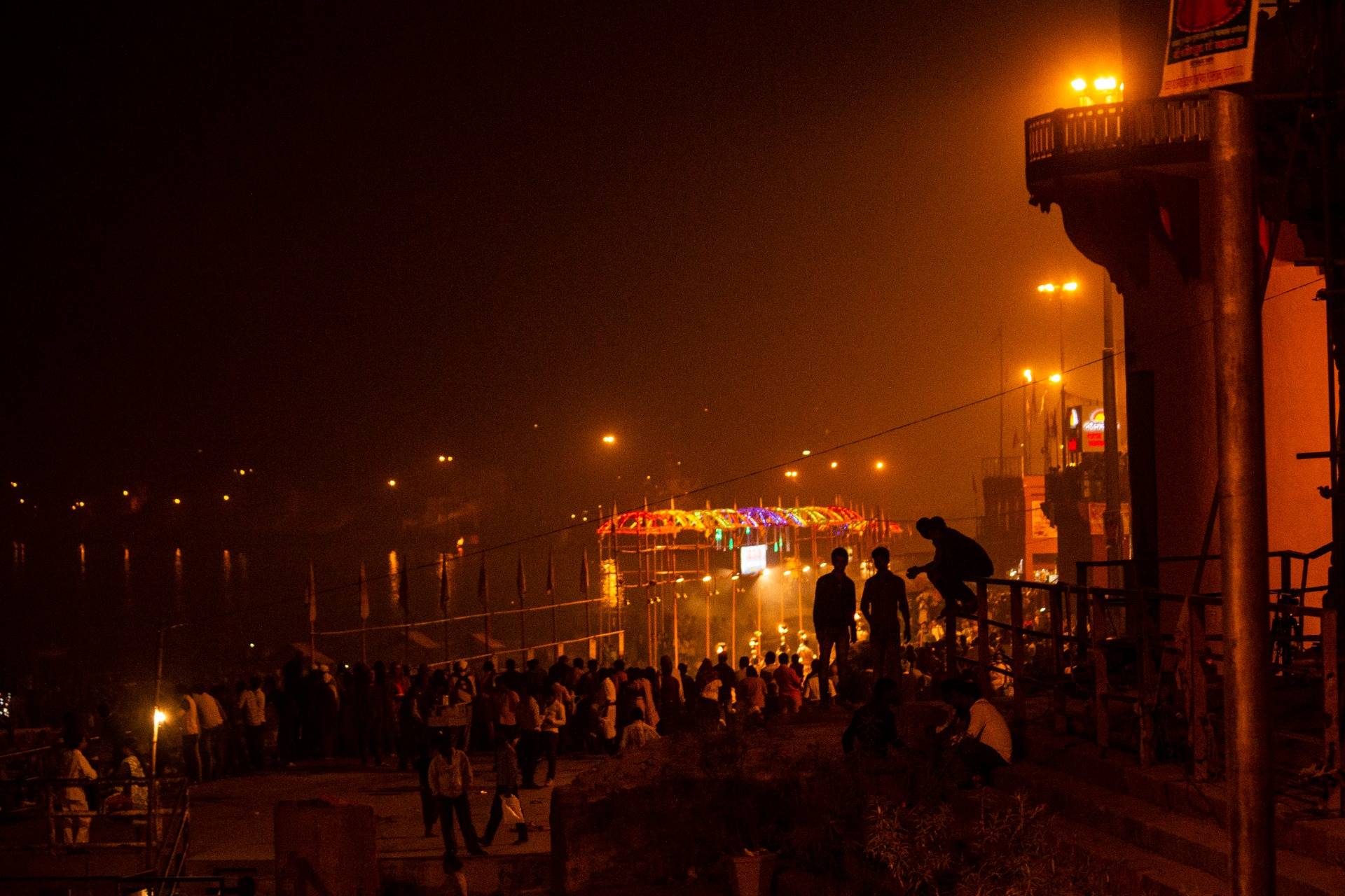 Crowds of youths hang out by the River Ganges smoking dope.