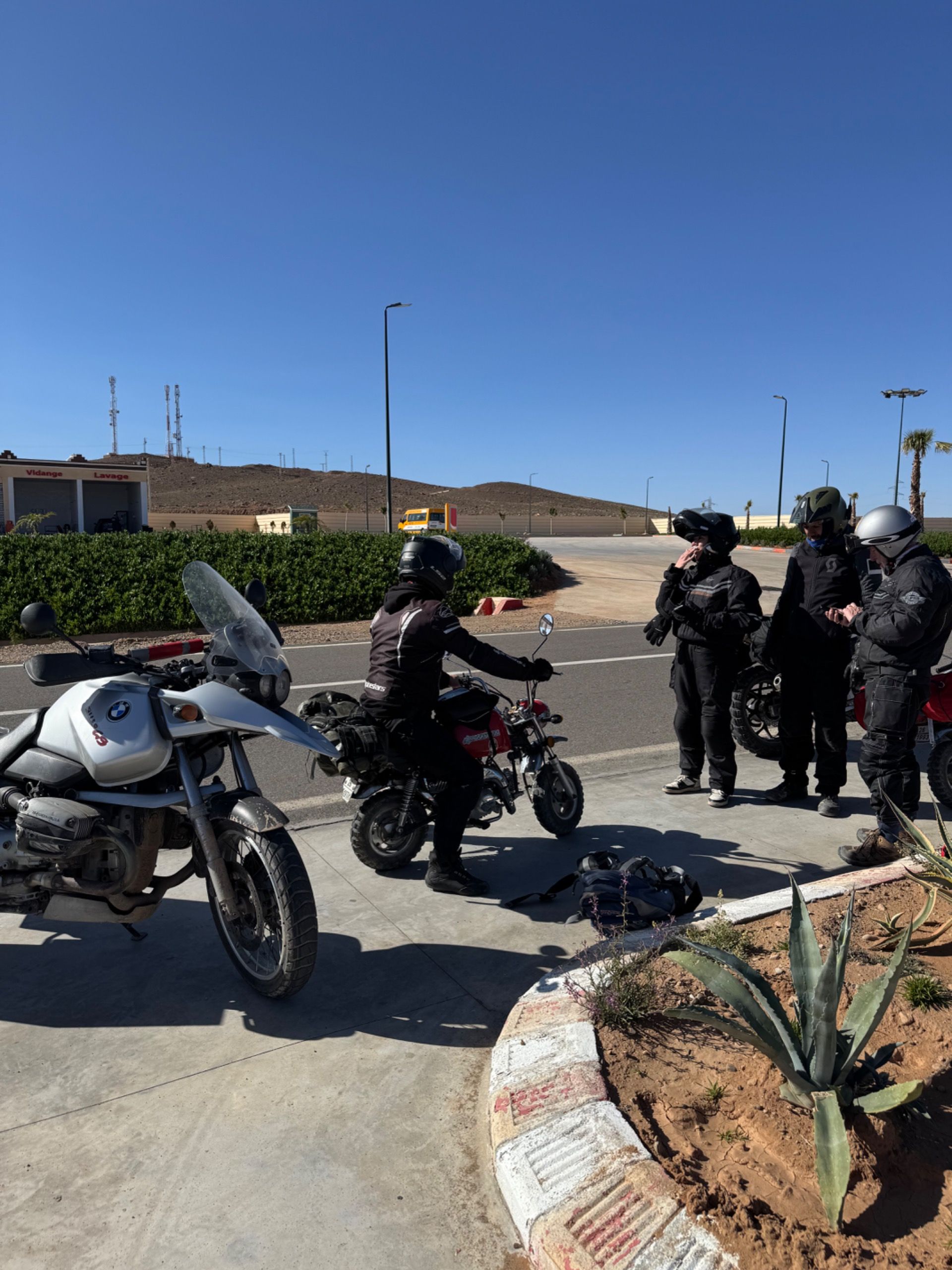 A Portuguese biker taking one of our monkeys for a spin, much to his and his friends’ delight.