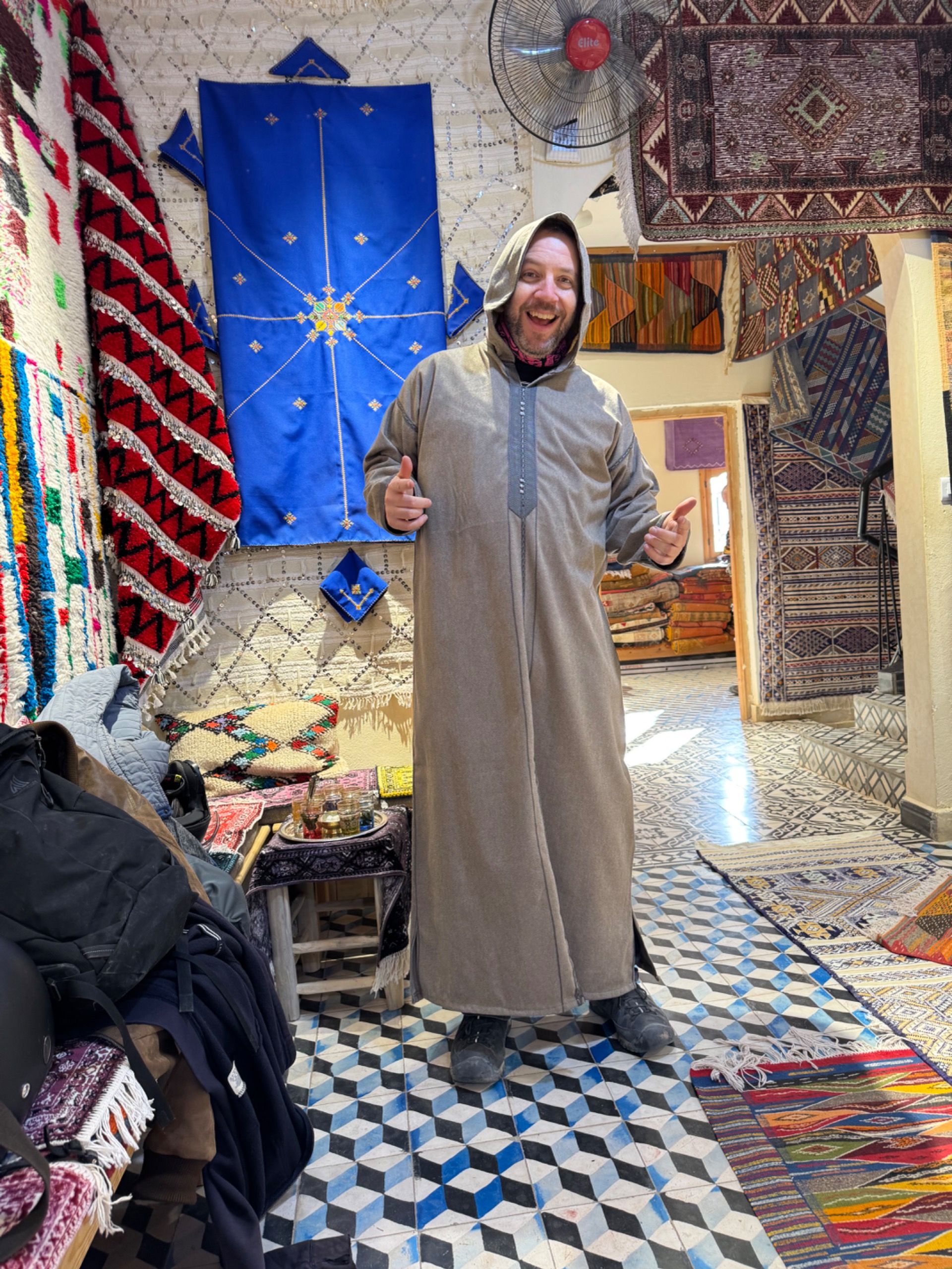 Trying on a djellaba. Quite cozy!