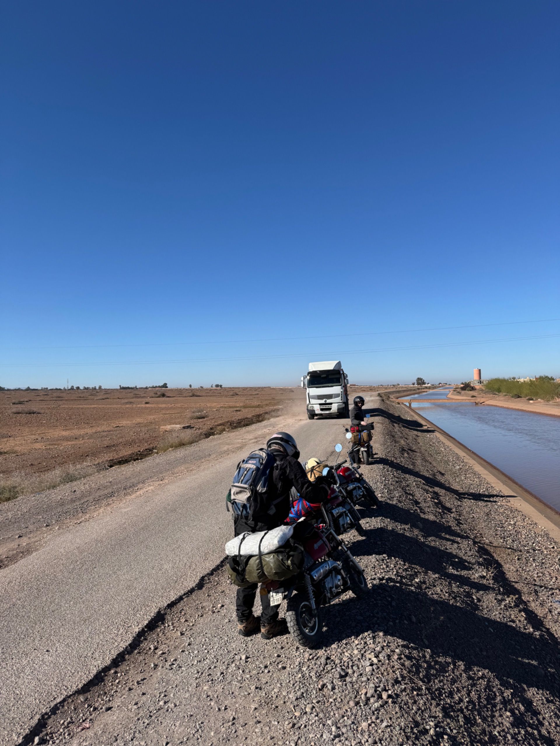 This road was bad. Not only cruddy asphalt and potholes, but real motorcycles, cars, and giant trucks to negotiate as well.