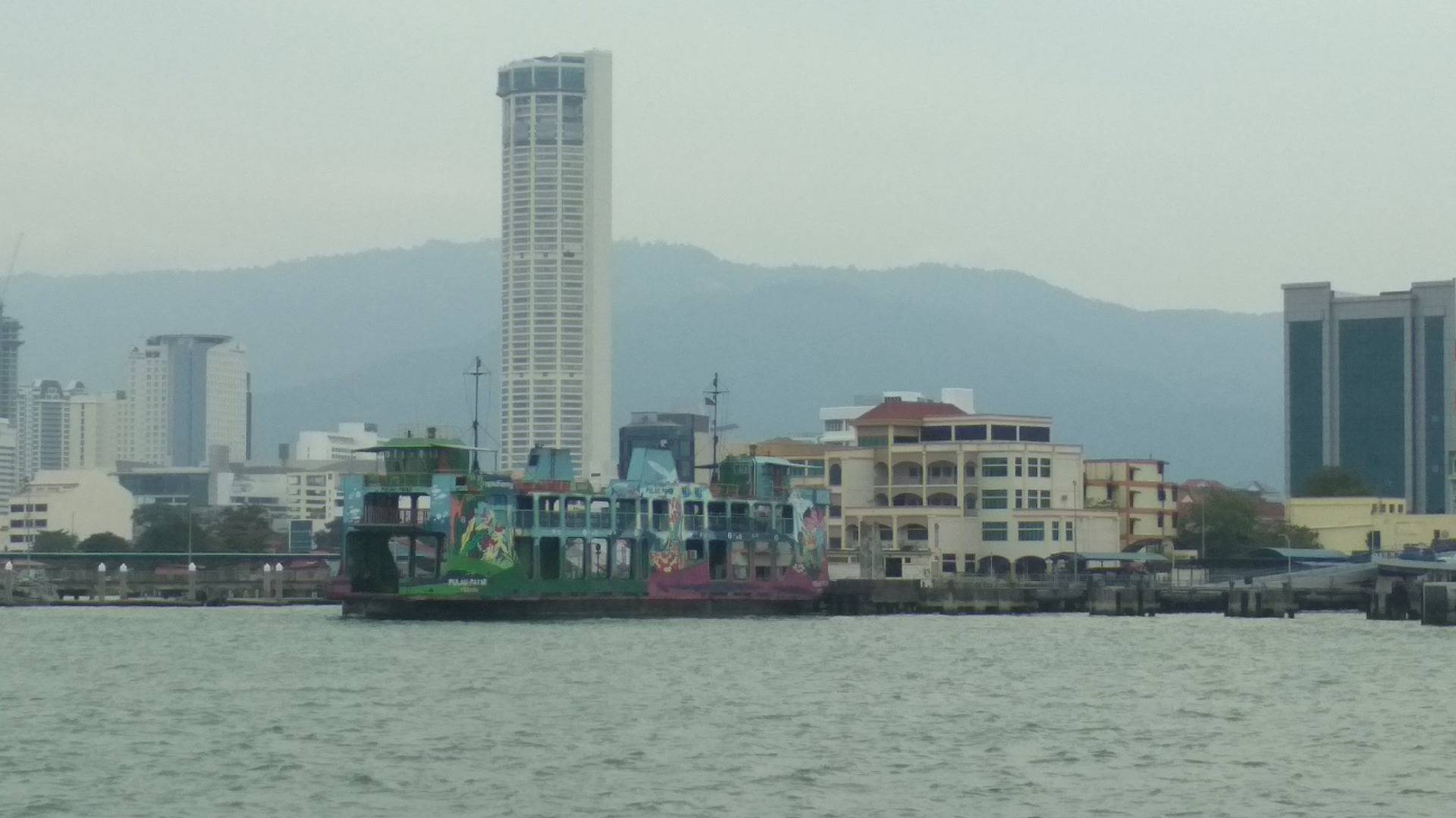 Significance of colorful old ferry and tallest building in the island - Komtar