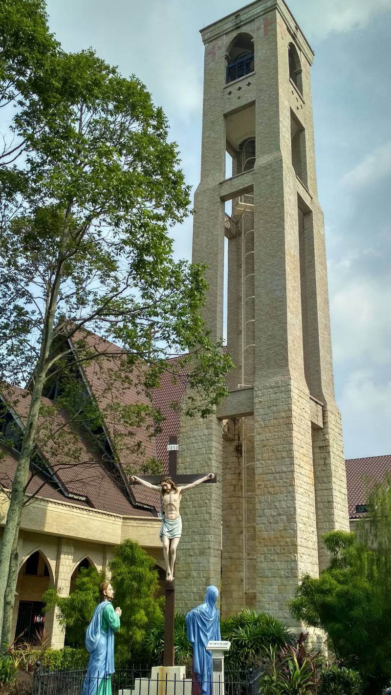 The bell tower and the crucifix at the front