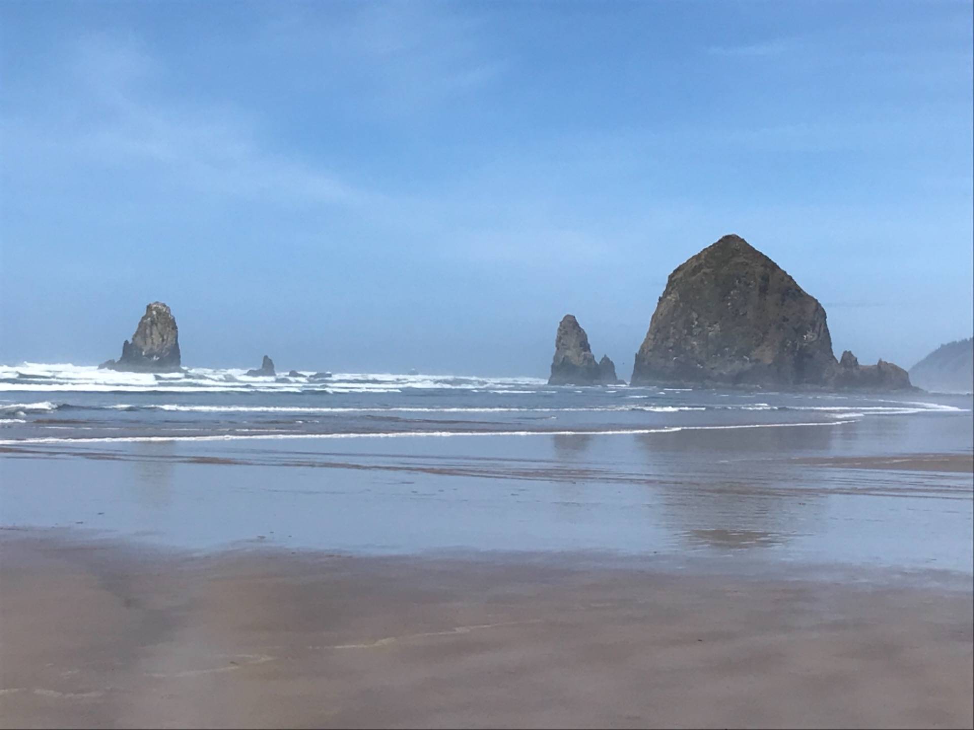 Haystack Rock, in Cannon Beach, is the most recognizable and photographed landmark on the Oregon Coast. The rock itself is a breeding ground for tufted puffins, and the base is surrounded by tidal pools.