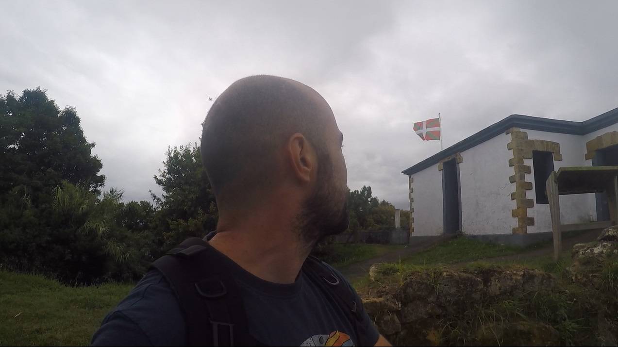 The Ikurriña (official Basque Country flag) waving in the wind.