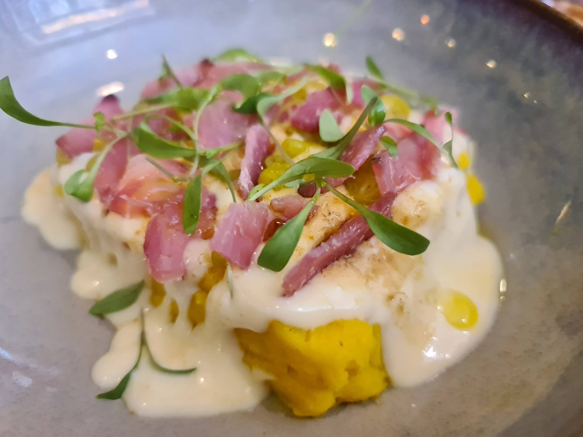 ”Our Russian salad ’causa limeña’-style” (potato base with yellow chili -spicy low-, mayonnaise made with canned tuna oil and salted bonito slices topping) (€10.50) (2).