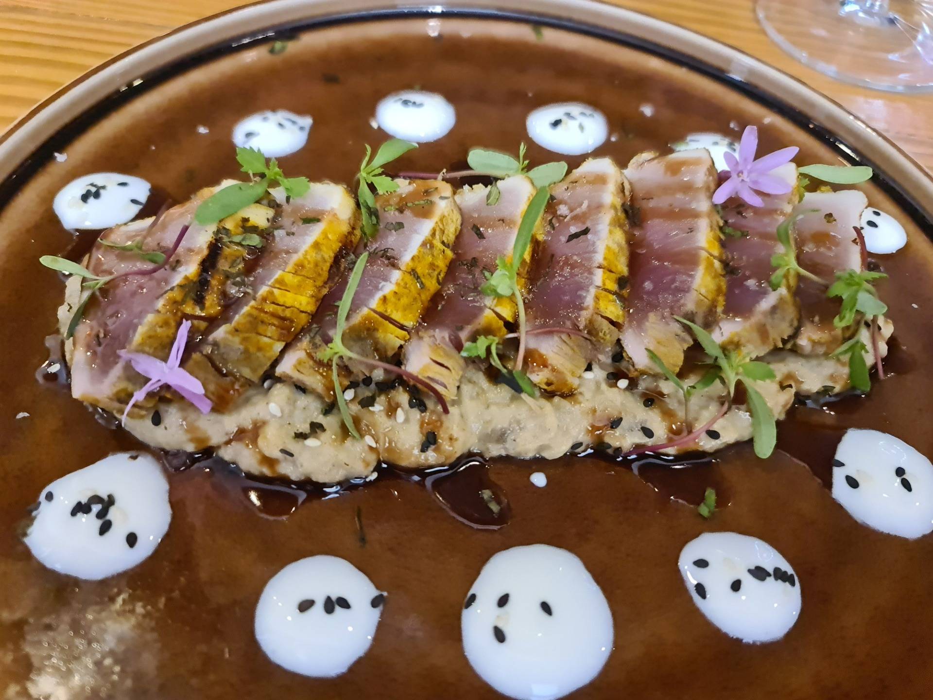 Lebanese style bonito (white tuna) marinated in ras-el-hanout and caraway on a Baba Ghanoush (Arabic eggplant paste) with pomegranate molasses, yogurt dots, tangerine sprouts and pine nuts (€21.50) (3).