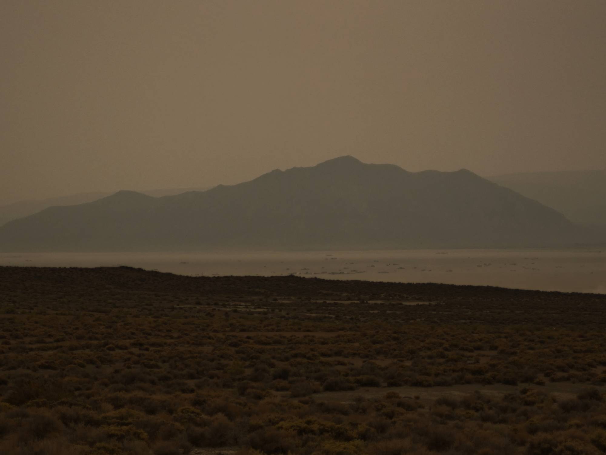 Heavy smoke from the forest fires in California has settled on Black Rock City. Old Sawtooth Mountain in the background.