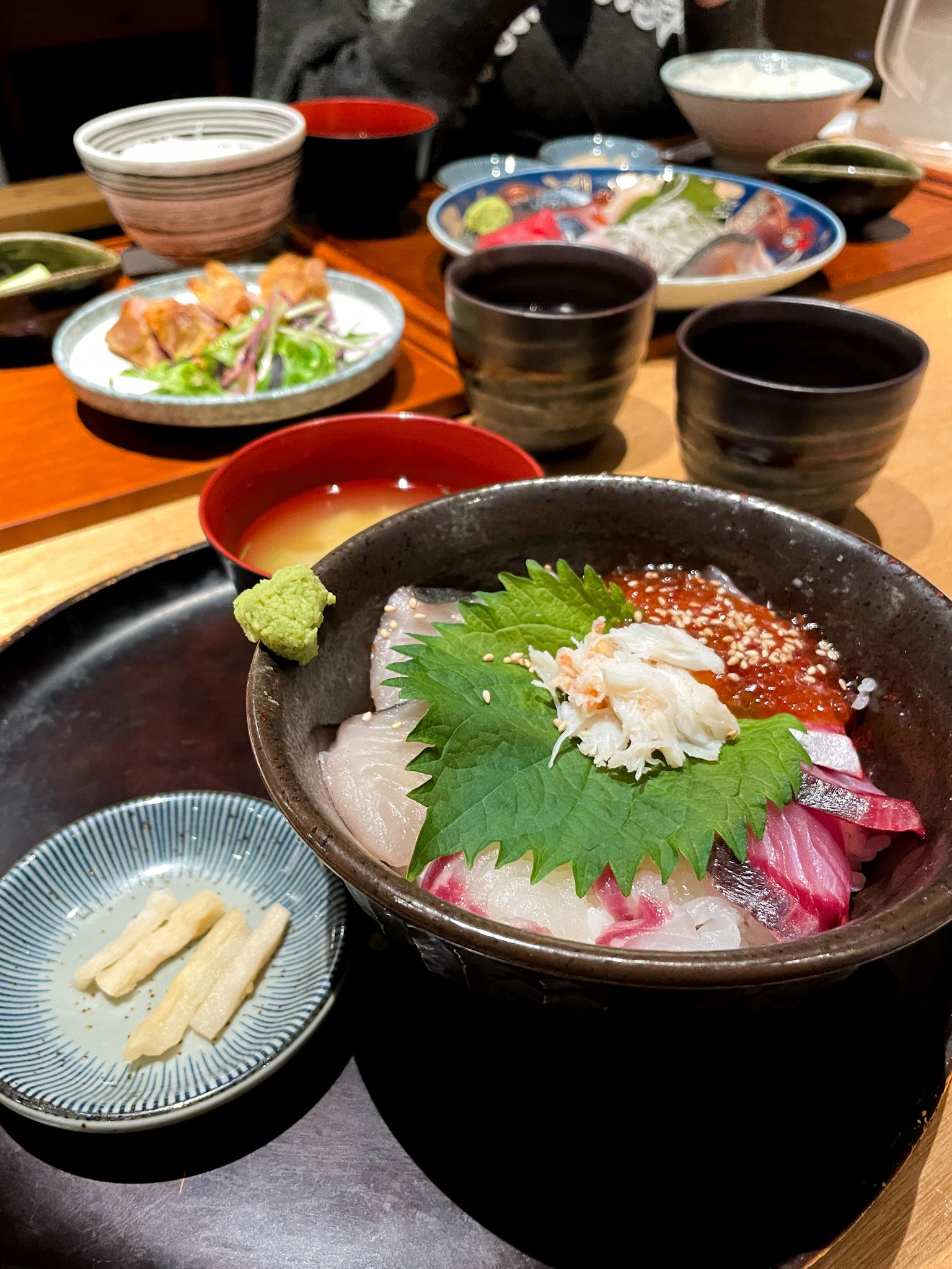 seafood bowl set with miso soup and japanese pickles