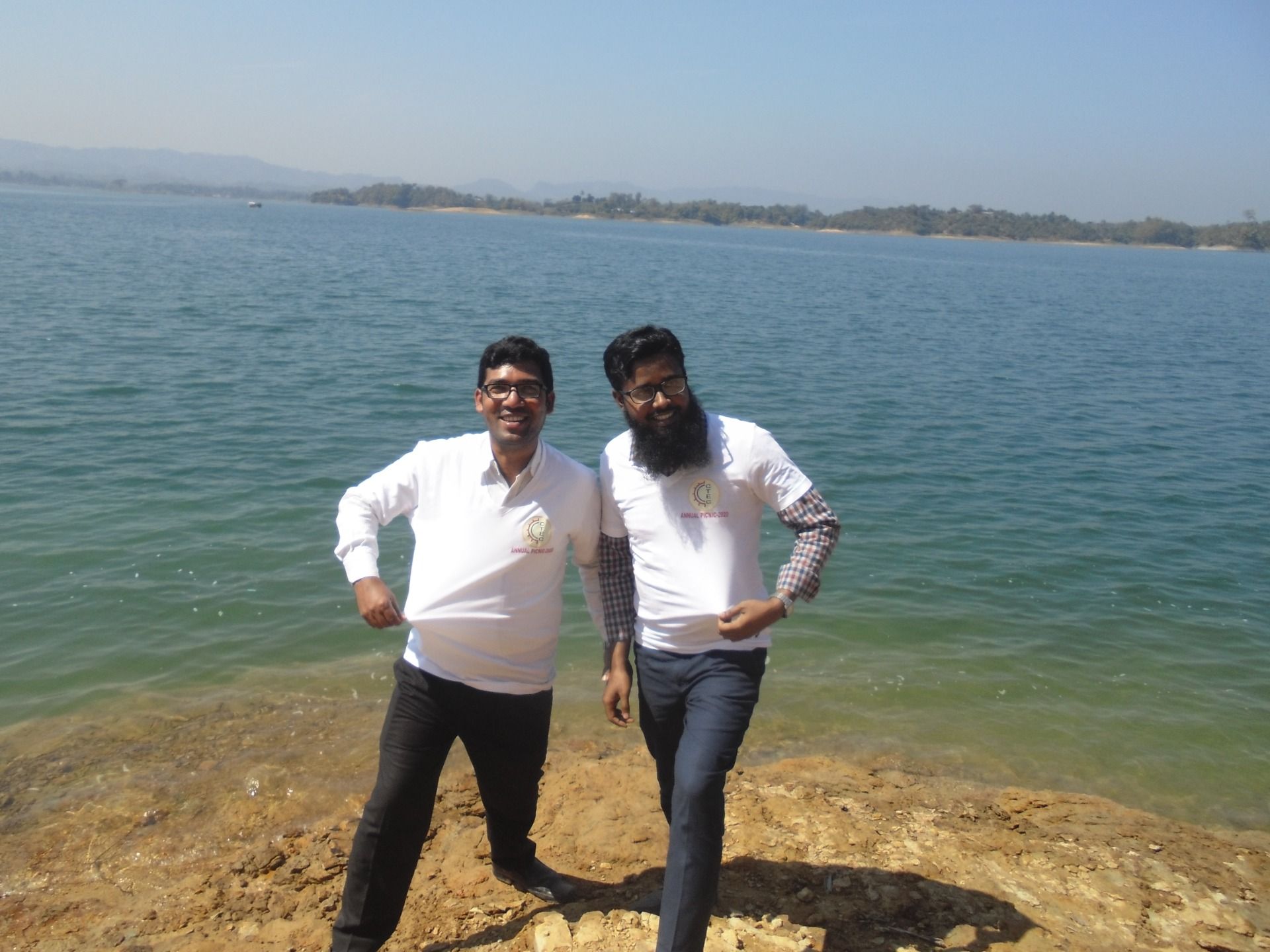 With colleague in front of lake