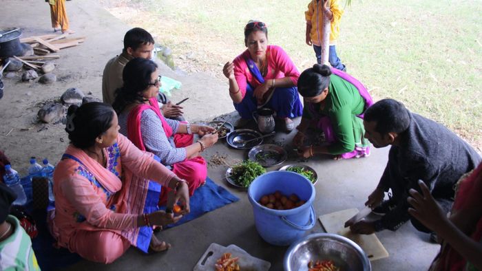 Teachers cooking for children during a school trip to Chitwan National Park [3/3]