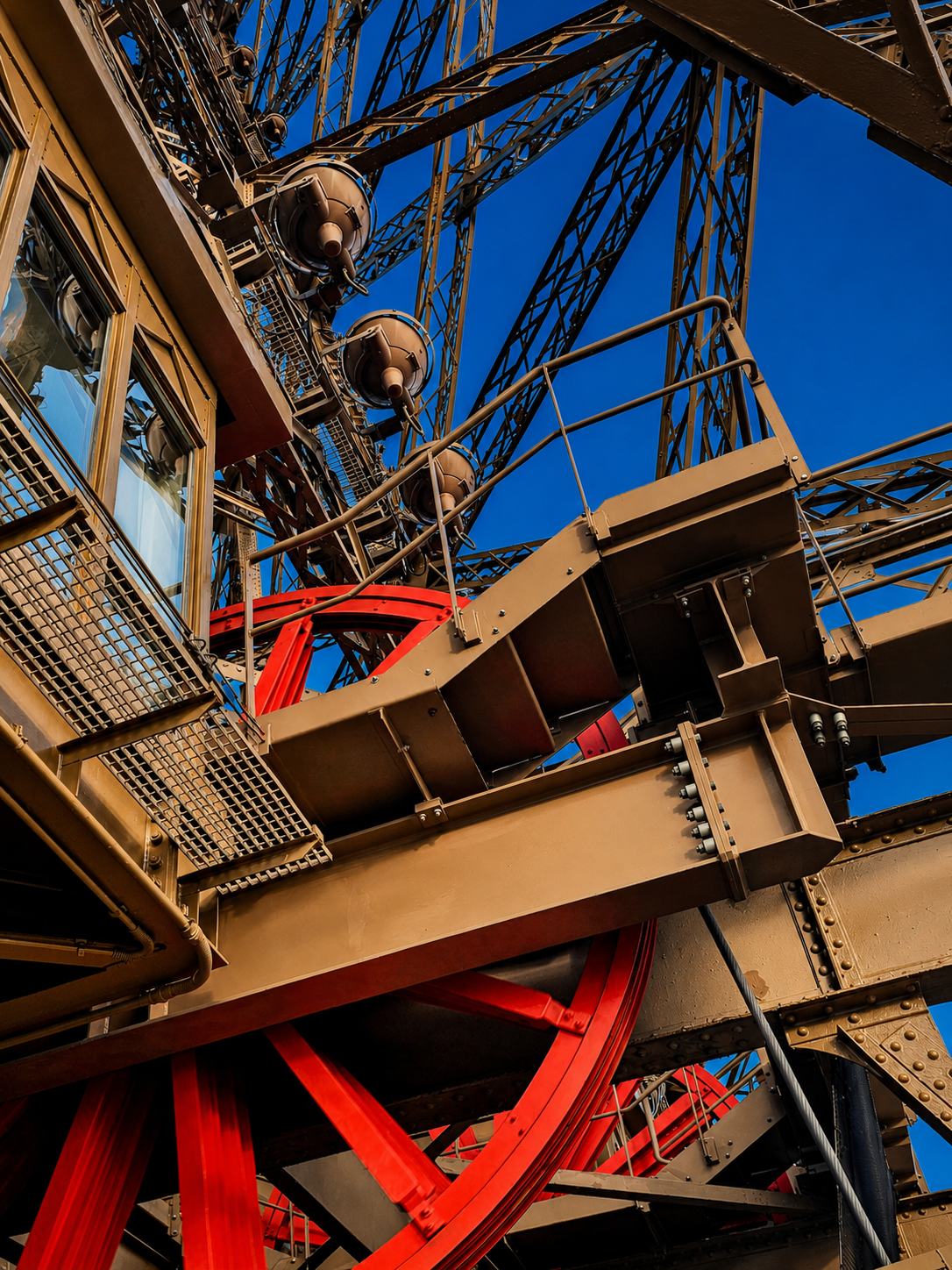 Inside the Eiffel Tower, the monument revealed itself as an enormous piece of working nineteenth-century engineering.