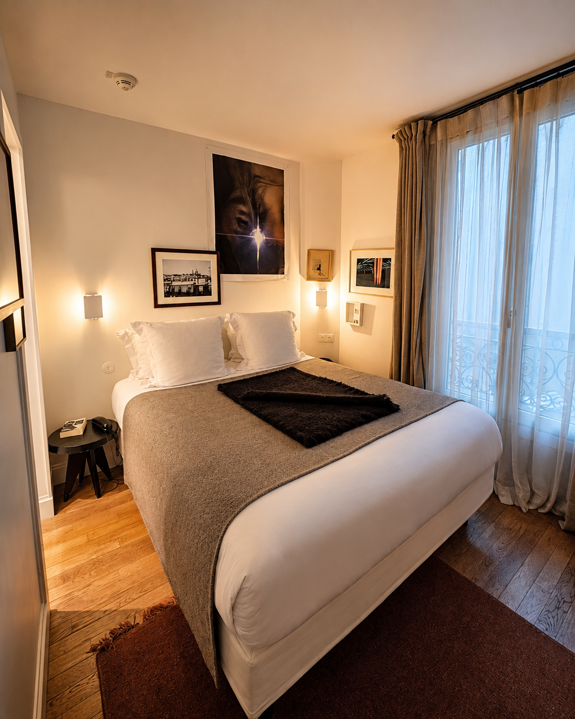 My upgraded room at Le Pigalle—warm, individual and so compact that “cosy” would have required some serious diplomatic flexibility.