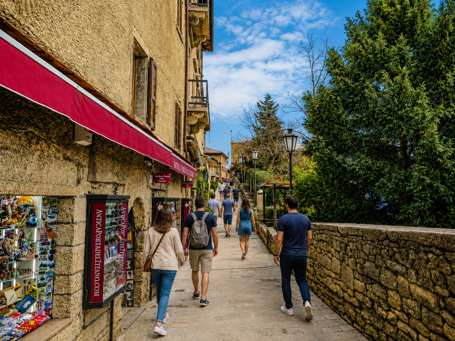 In San Marino, medieval stone and souvenir commerce compete for the same narrow strip of pavement.