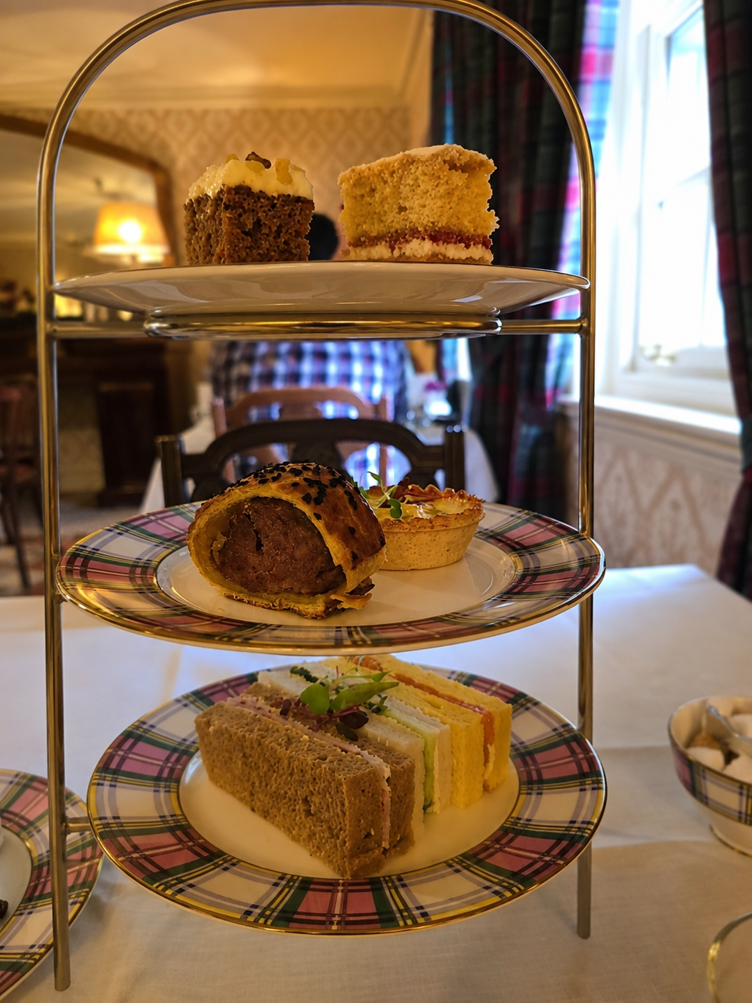 The tartan crockery was more distinctive than the food it carried.