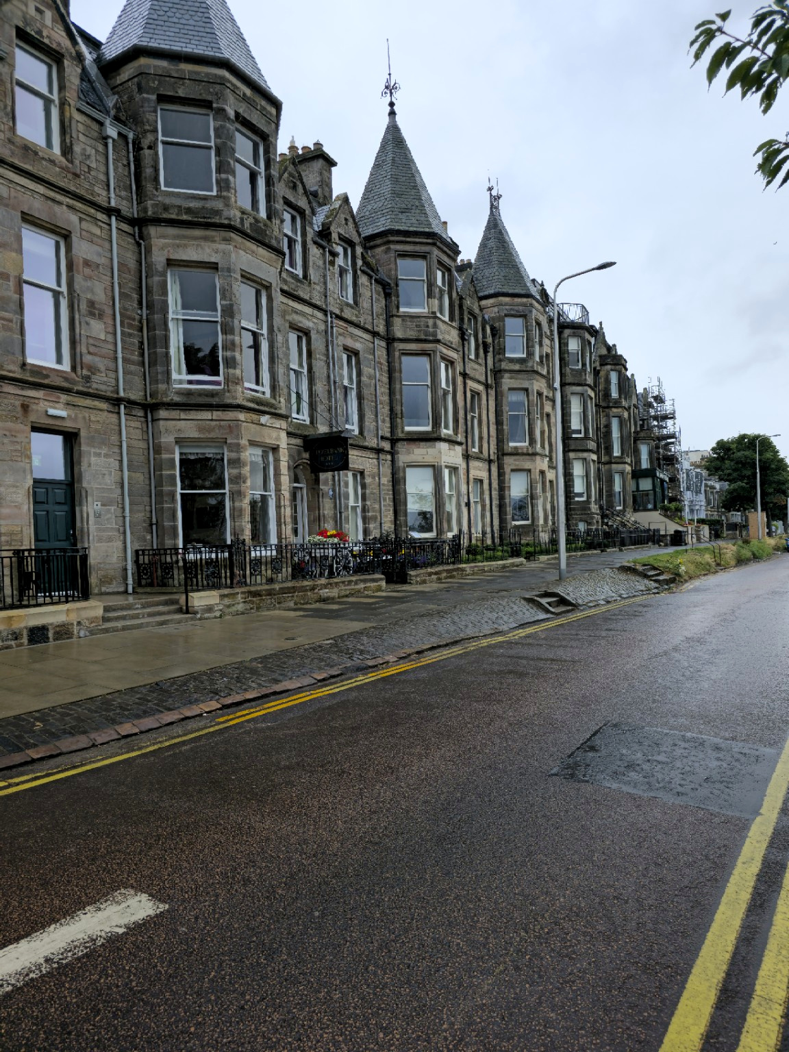 South Street on arrival: wet stone, empty pavements and St Andrews making no effort whatsoever to appear welcoming.