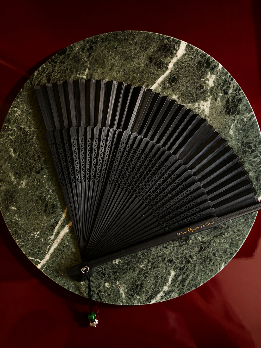 A souvenir fan from the Arena Opera Festival — less merchandise than emergency equipment once Verona reached forty degrees.