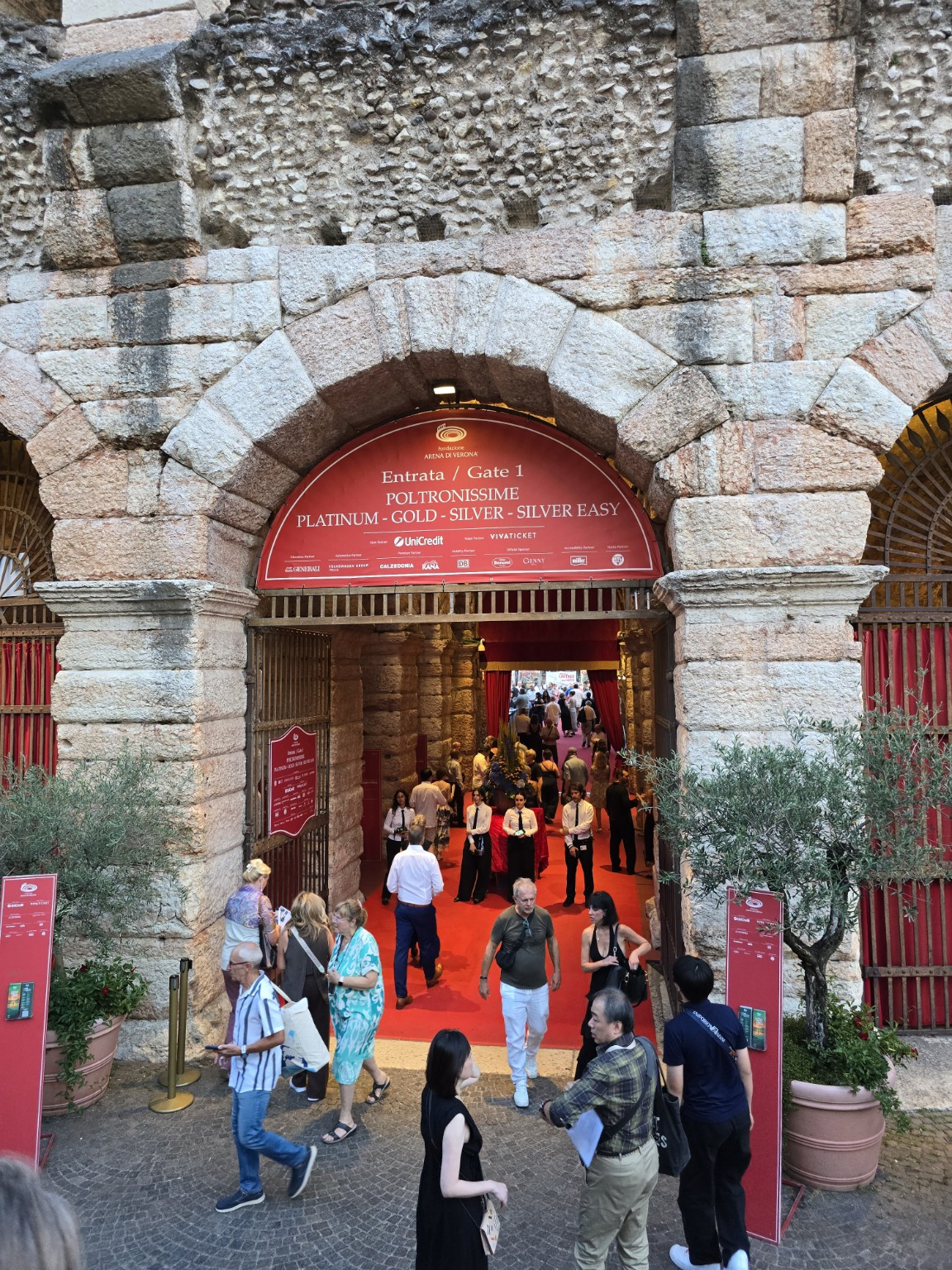 Gate 1 and the red carpet into the Arena — the point where a hot evening in Verona formally became an opera night.