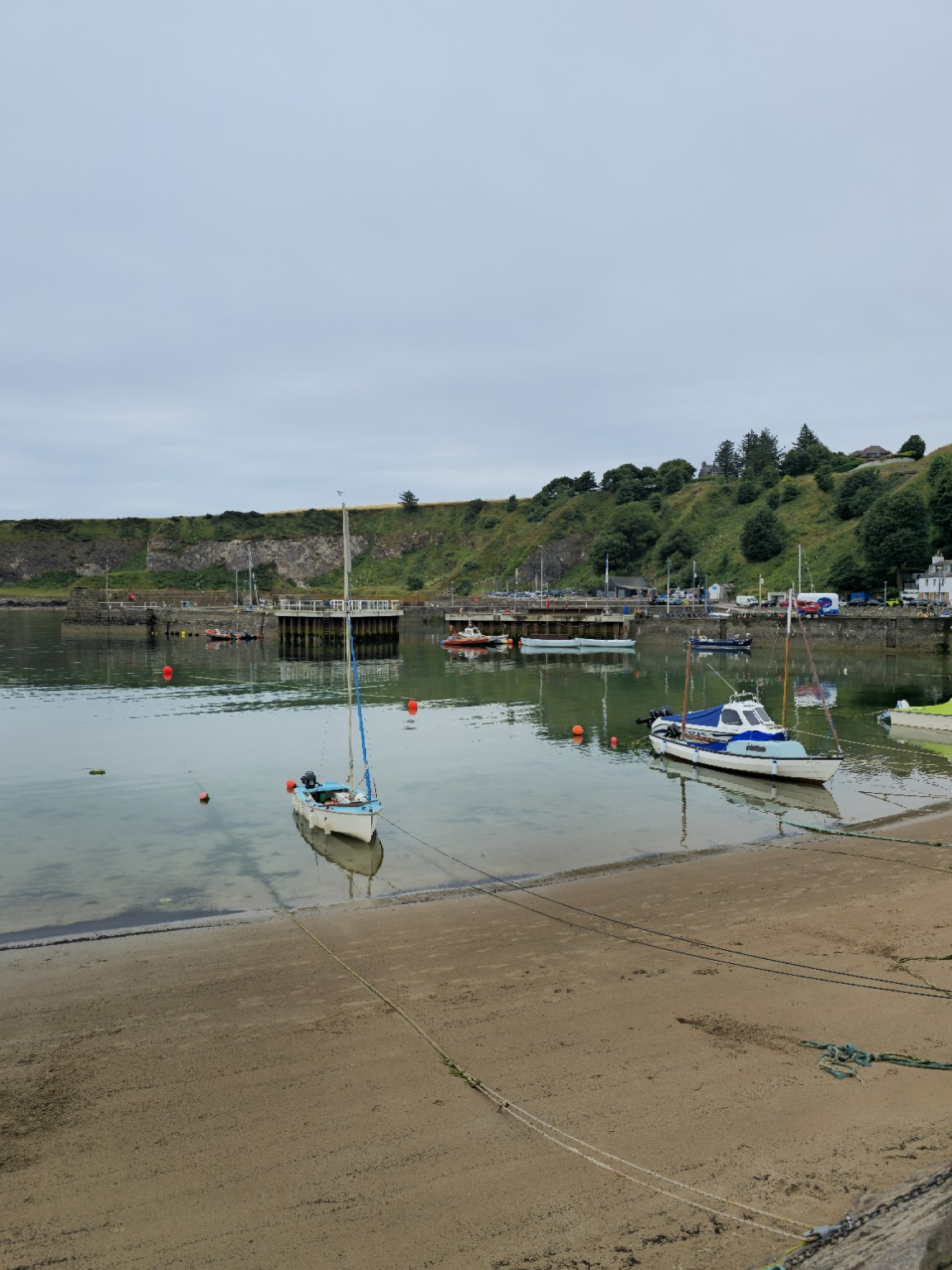 Low tide in Stonehaven Harbour, where the boats still appear to belong to the town rather than to its tourism campaign.