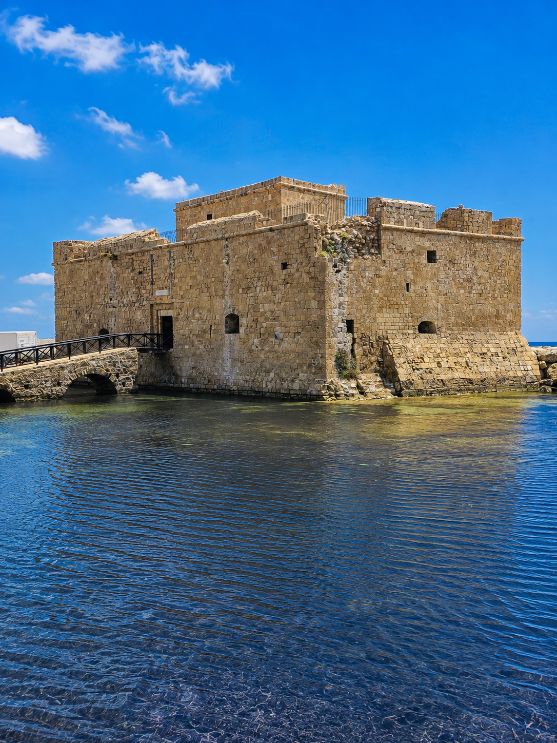 Paphos Castle at the harbour entrance, compact in scale but carrying several centuries of occupation and reinvention.