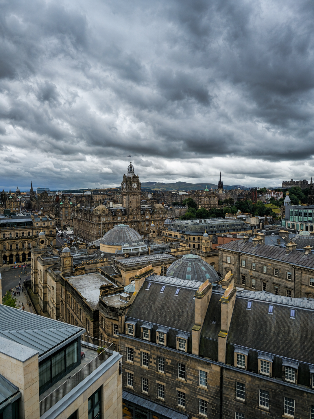 Edinburgh beneath a theatrical sky, seen from W’s rooftop shortly before the terrace was closed for “heavy wind.”