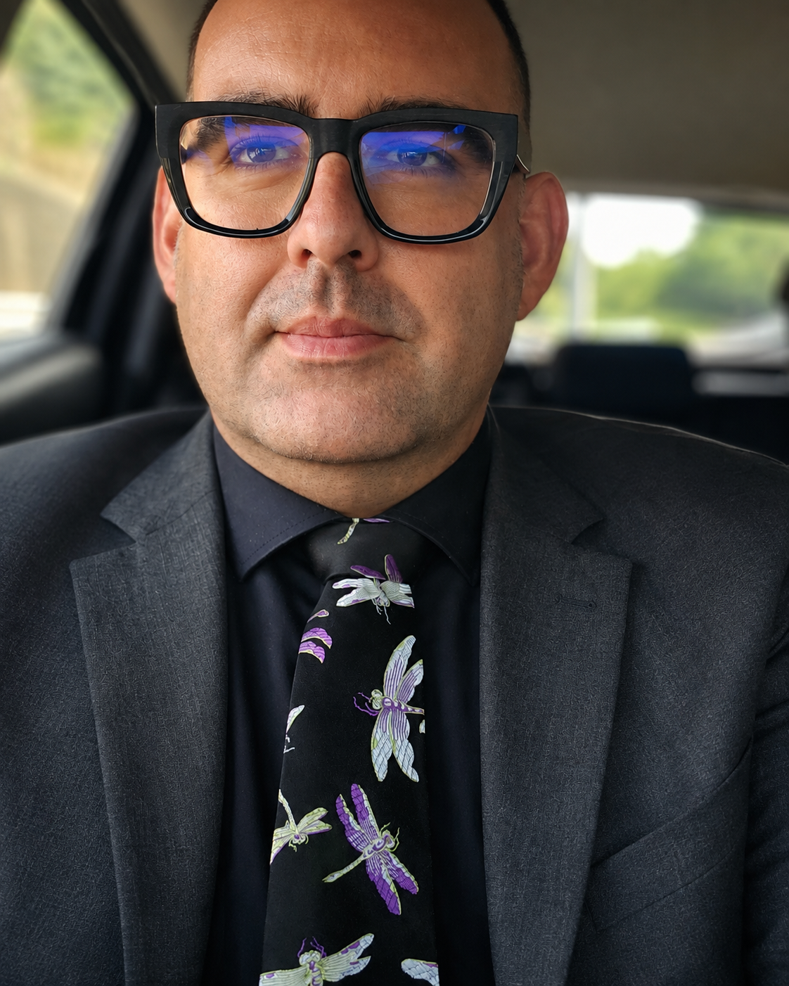 The second tie requires slightly more commitment: silk, unmistakably Chinese and decorated with enough insects to arrive in the room before I do.