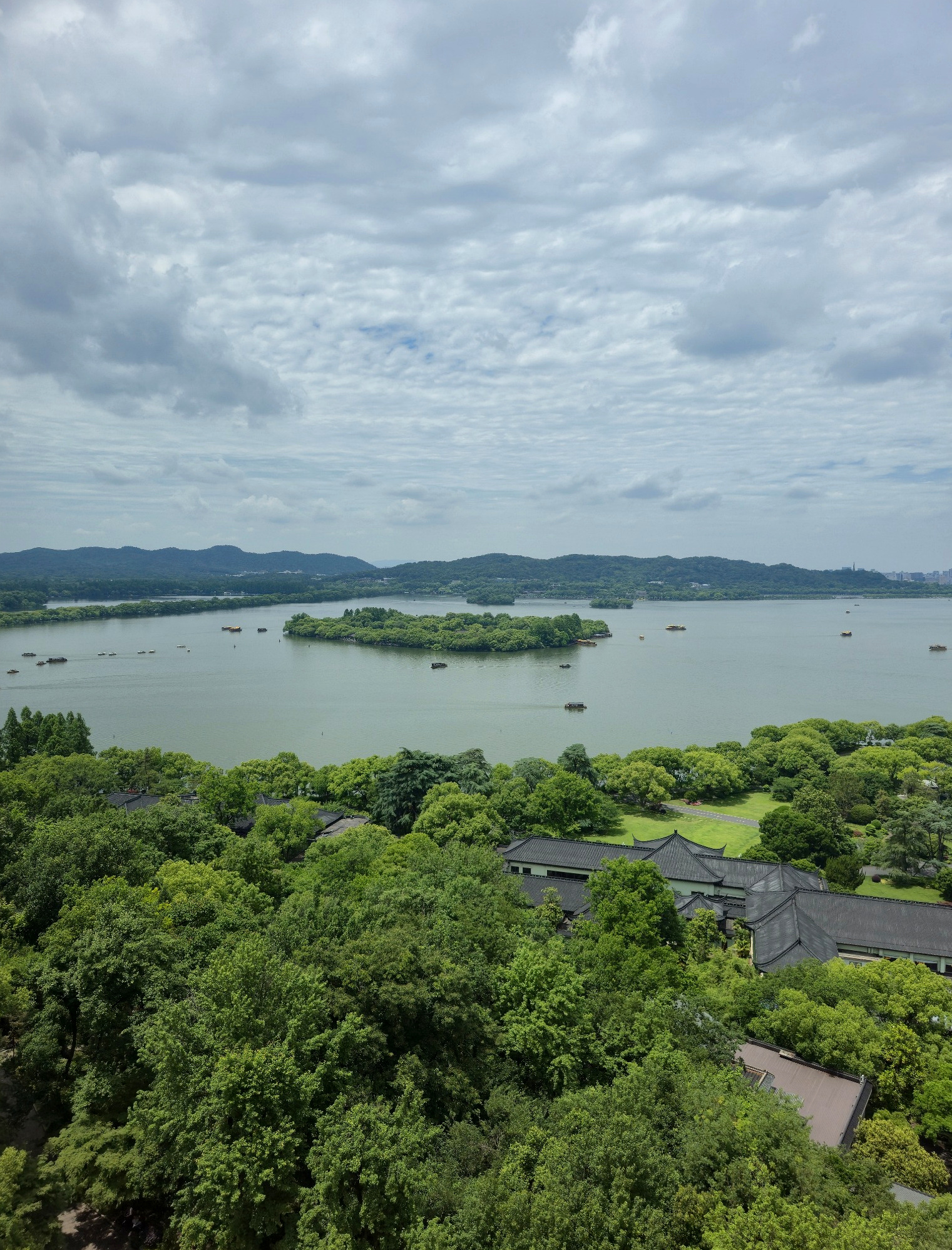 West Lake from the upper levels of Leifeng Pagoda, with its islands and wooded shores spreading below.