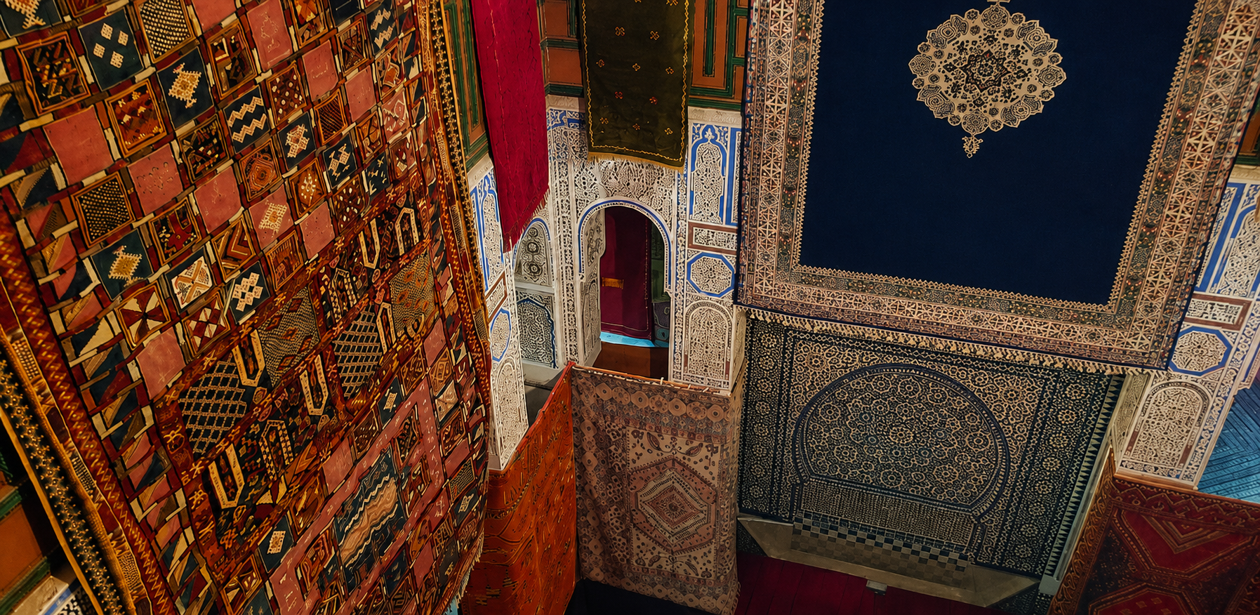 Inside a carpet shop in Fes el-Bali — layers of colour, pattern and craftsmanship, all part of a sales performance whose enthusiasm did not depend on whether I was actually going to buy anything.