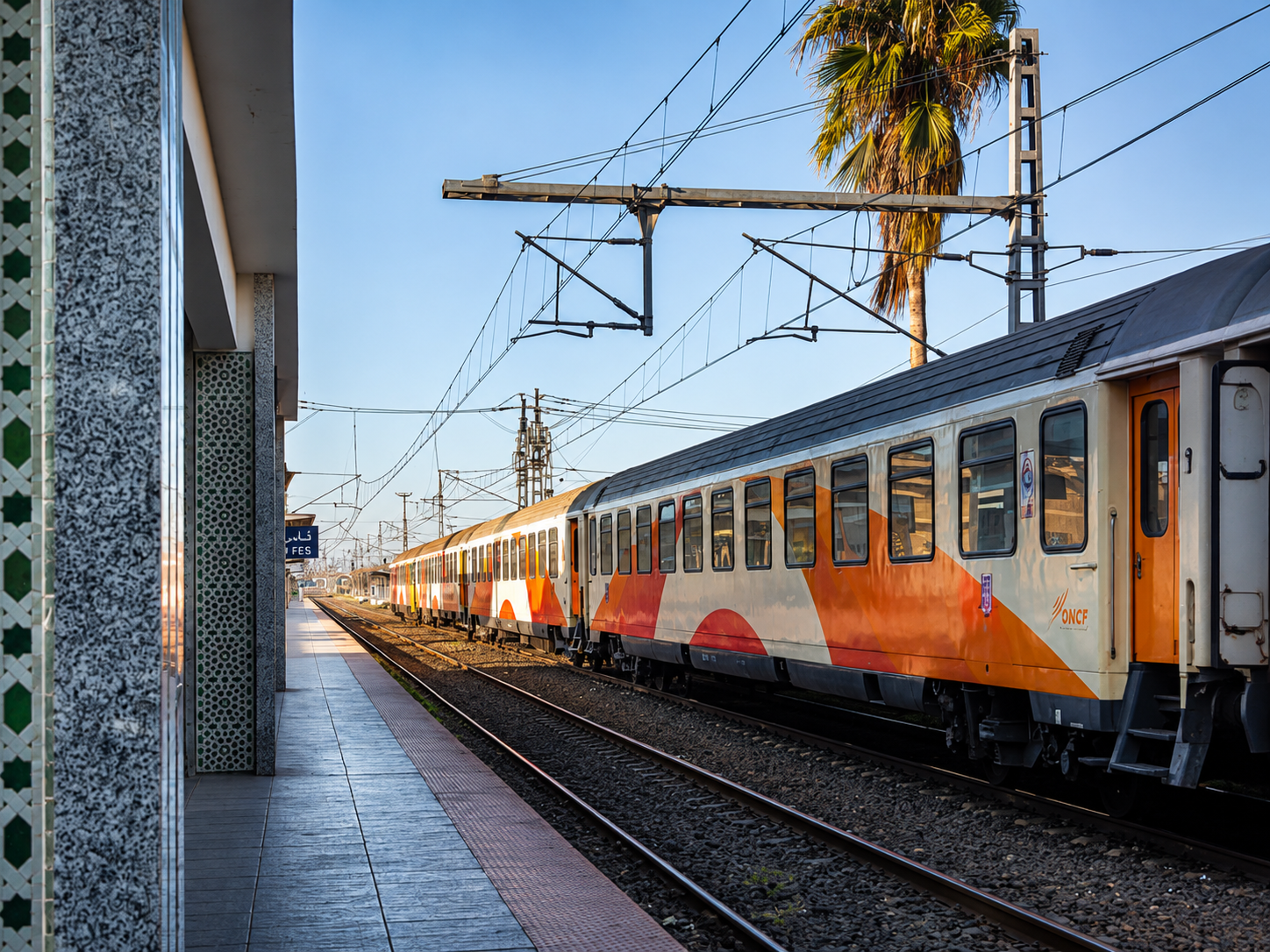 Fes railway station — my train to Rabat waiting at the platform, carrying me from one version of Morocco toward another.