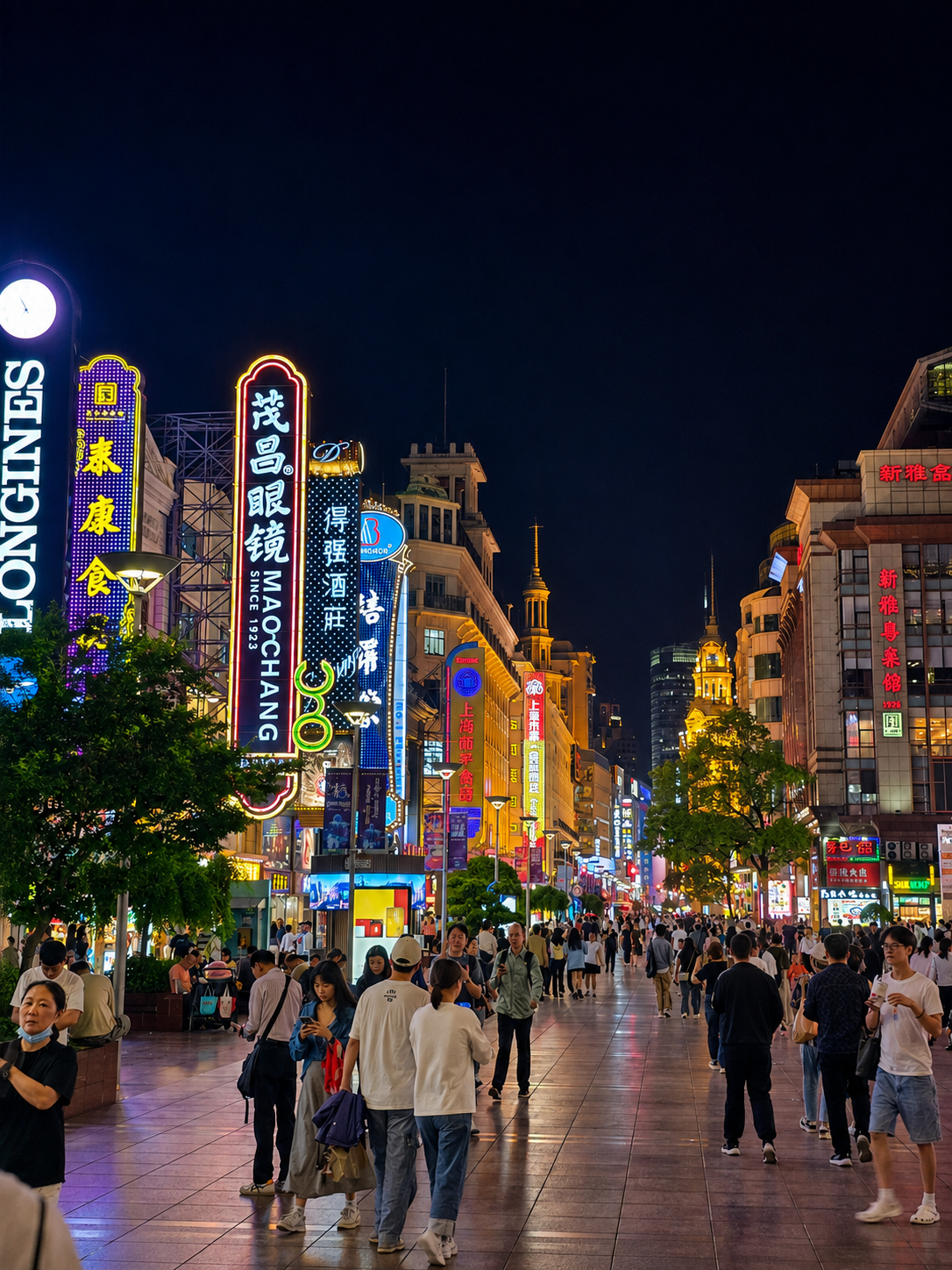 Nanjing Road pedestrian street in Shanghai at night, lined with illuminated signs and crowds.