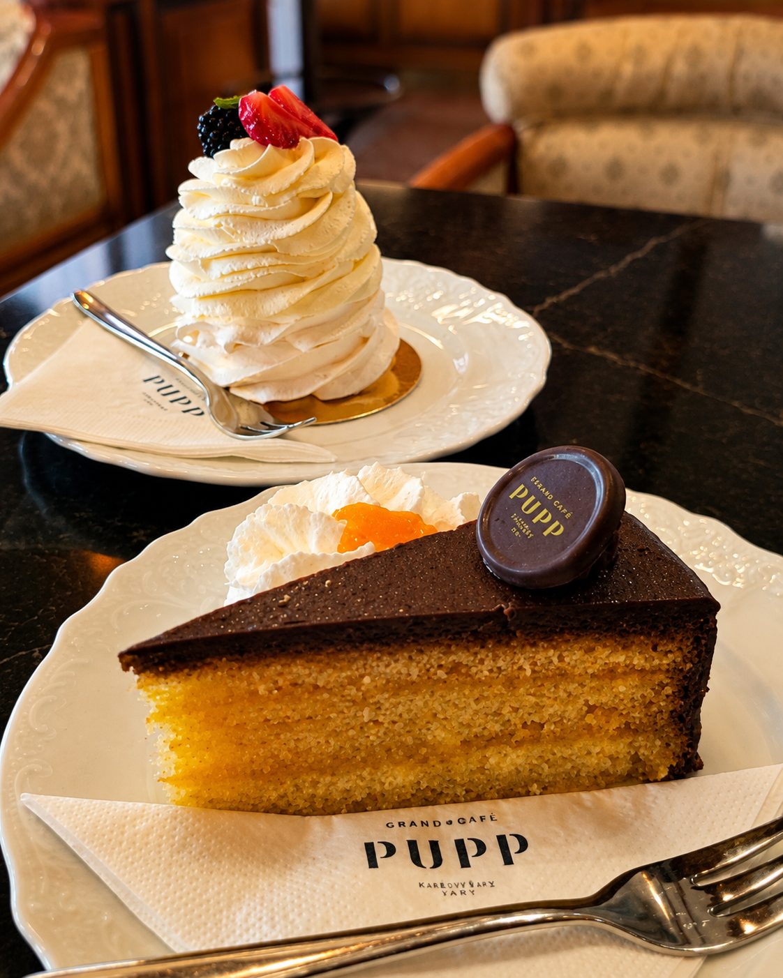 Pupp cake and a strawberry-mascarpone meringue — both excellent-looking, both far sweeter and heavier than I needed after hours in the heat.