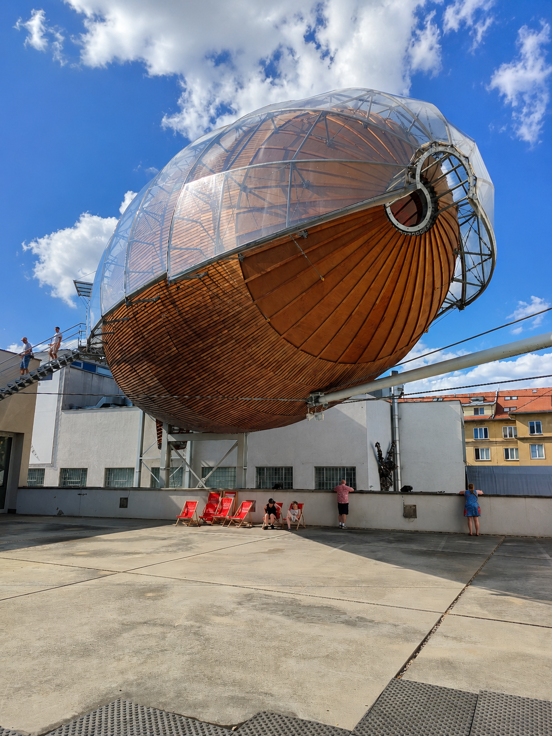 Gulliver, a giant wooden airship sculpture, suspended above DOX in Prague.
