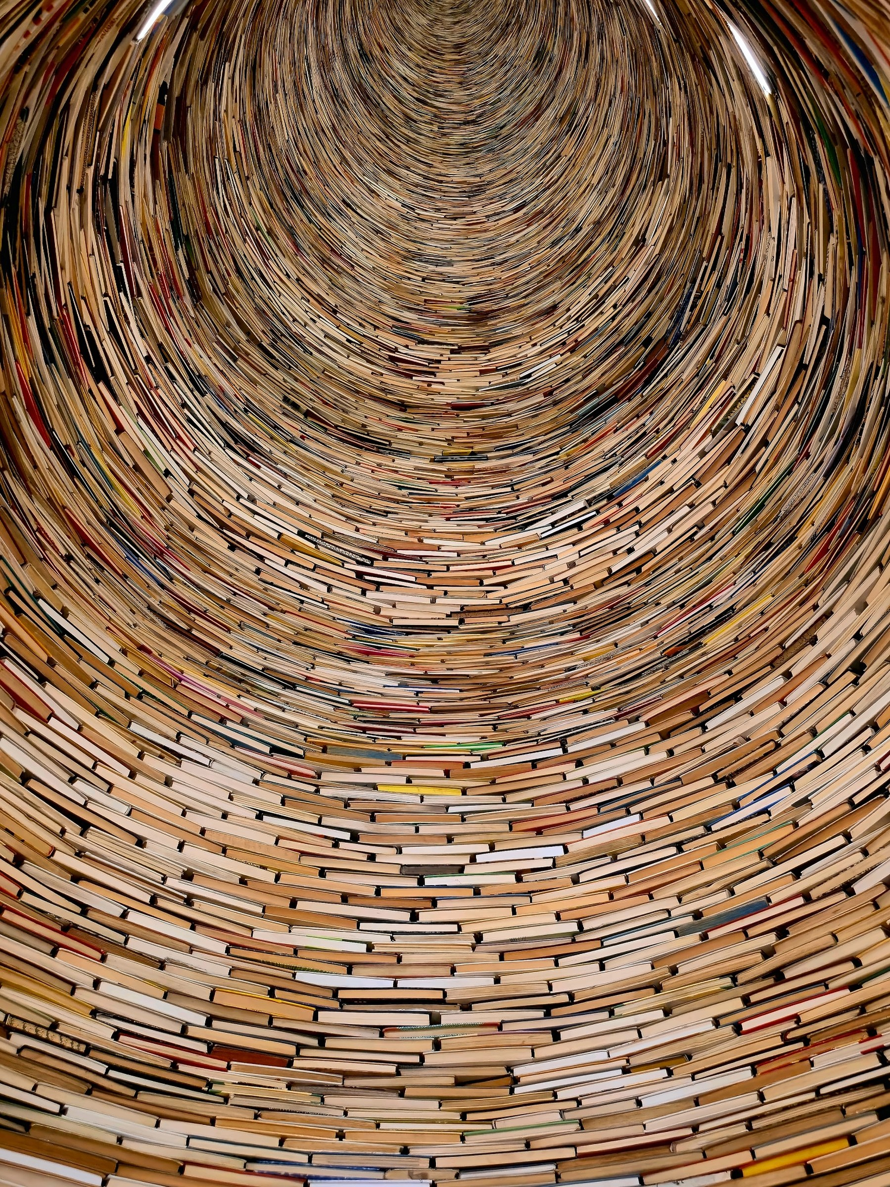 Stacked books form a tunnel inside Prague’s Municipal Library.