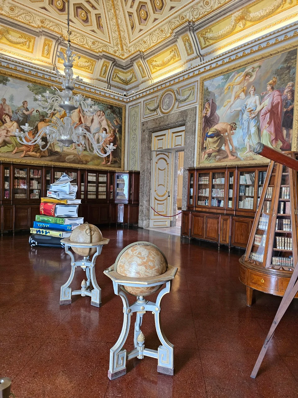 The library, complete with globes — one of the rooms that made me wish I had prepared better for the interiors.