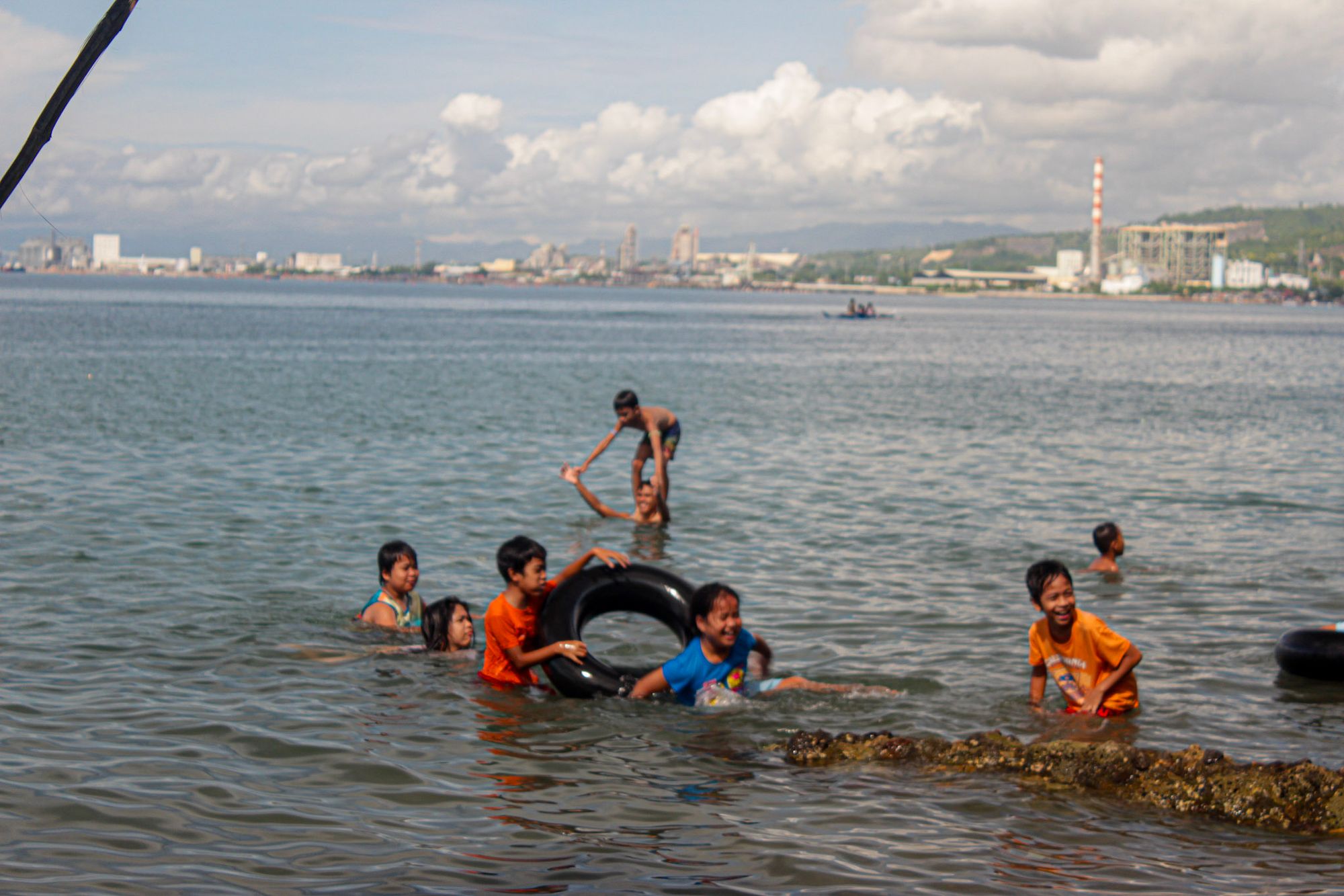 Kids having fun, City of Naga on the background