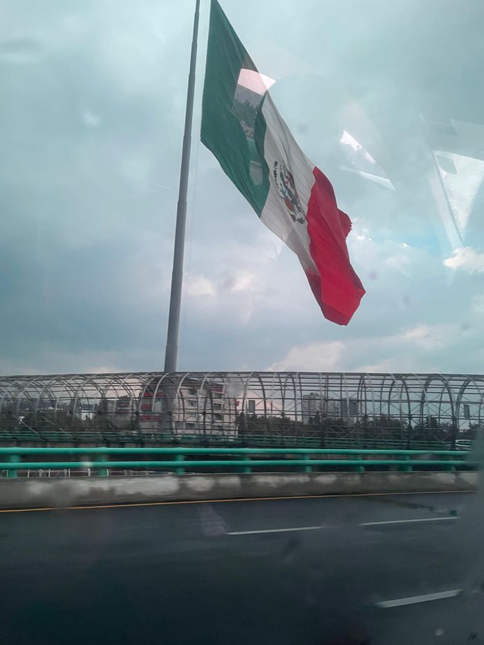 The largest flag I’ve ever seen (note the tiny cars driving beneath on the bridge). Viva México!