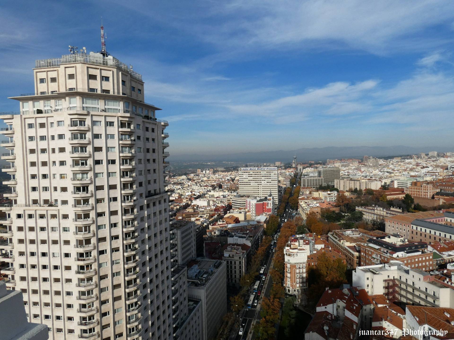 In the foreground, the grandiose Tower of Madrid