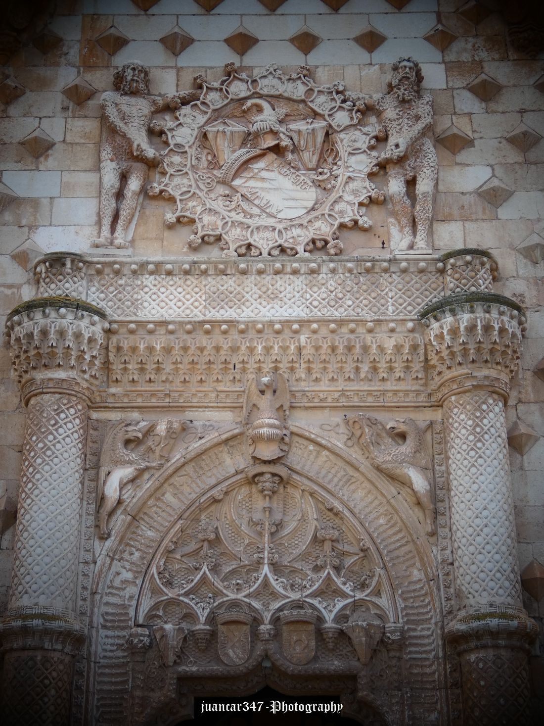 Main portico, with arabesques and shield