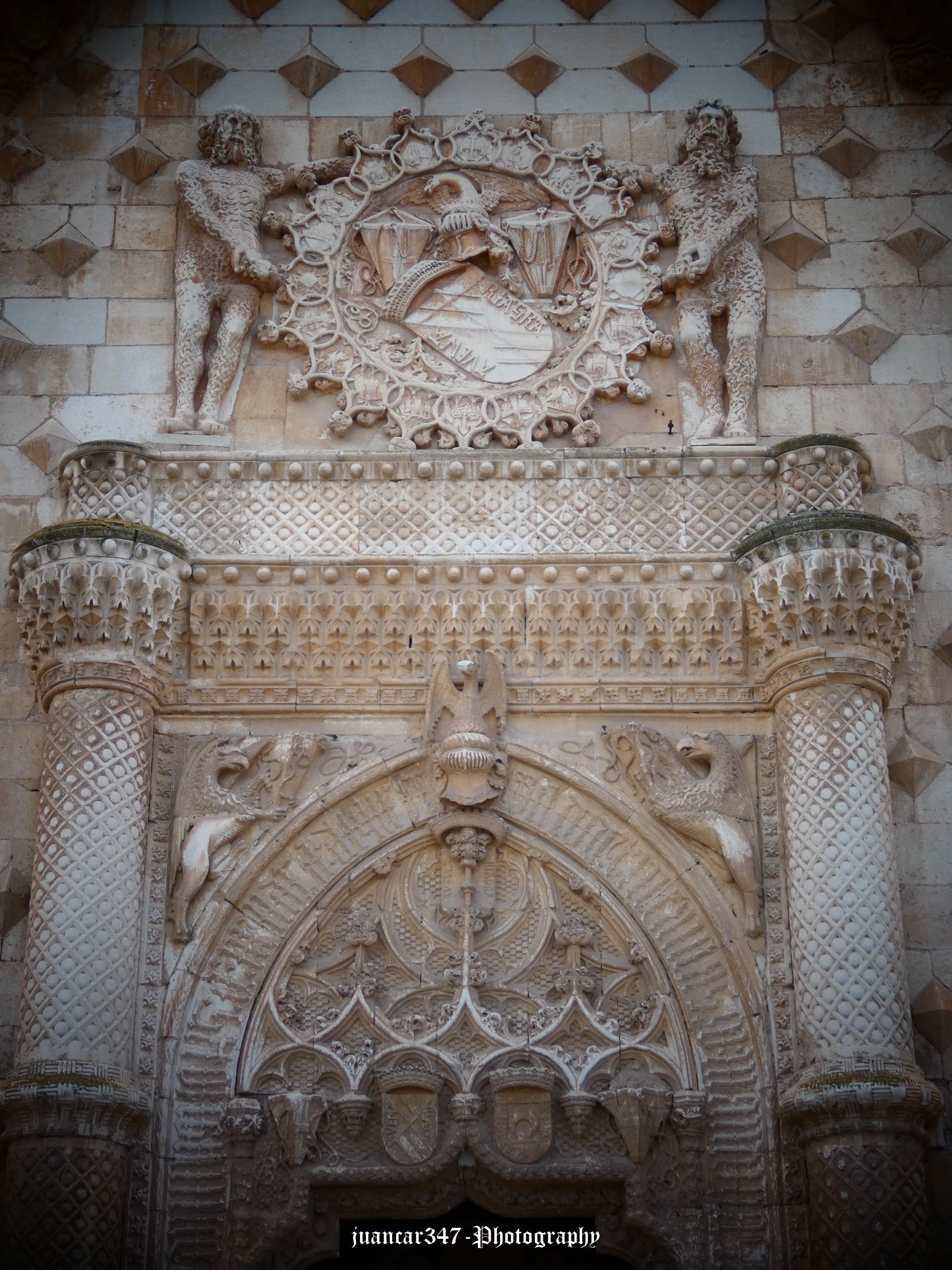 Main portico, with arabesques and shield