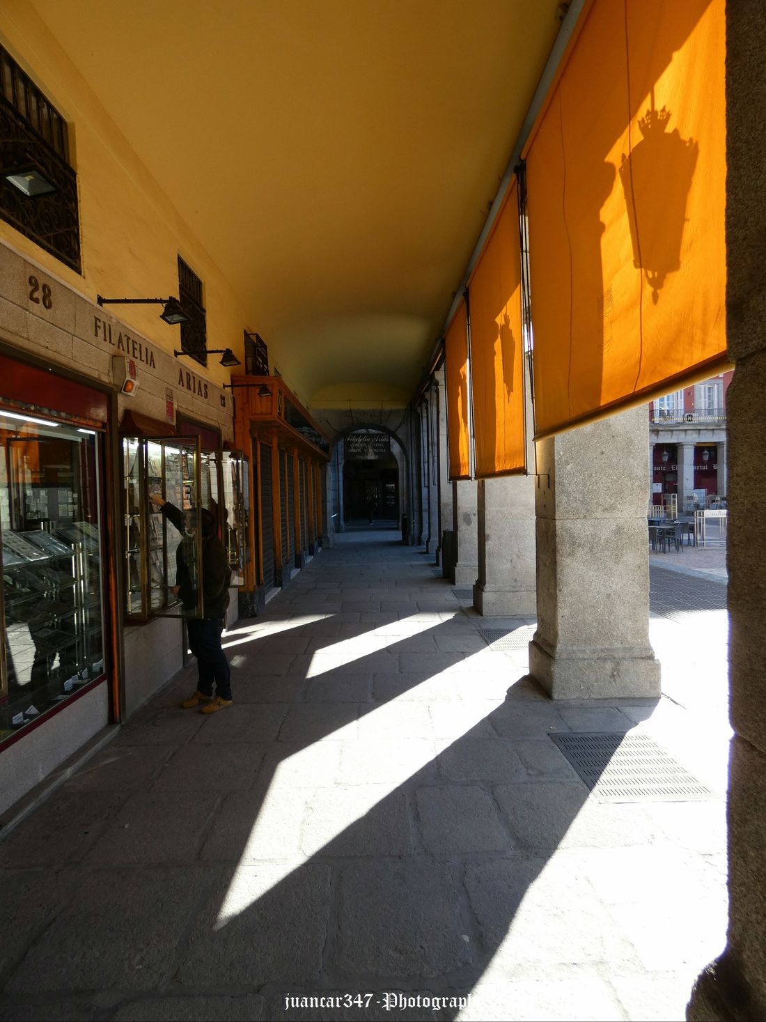 The shadow of the old lanterns reflected in the awnings
