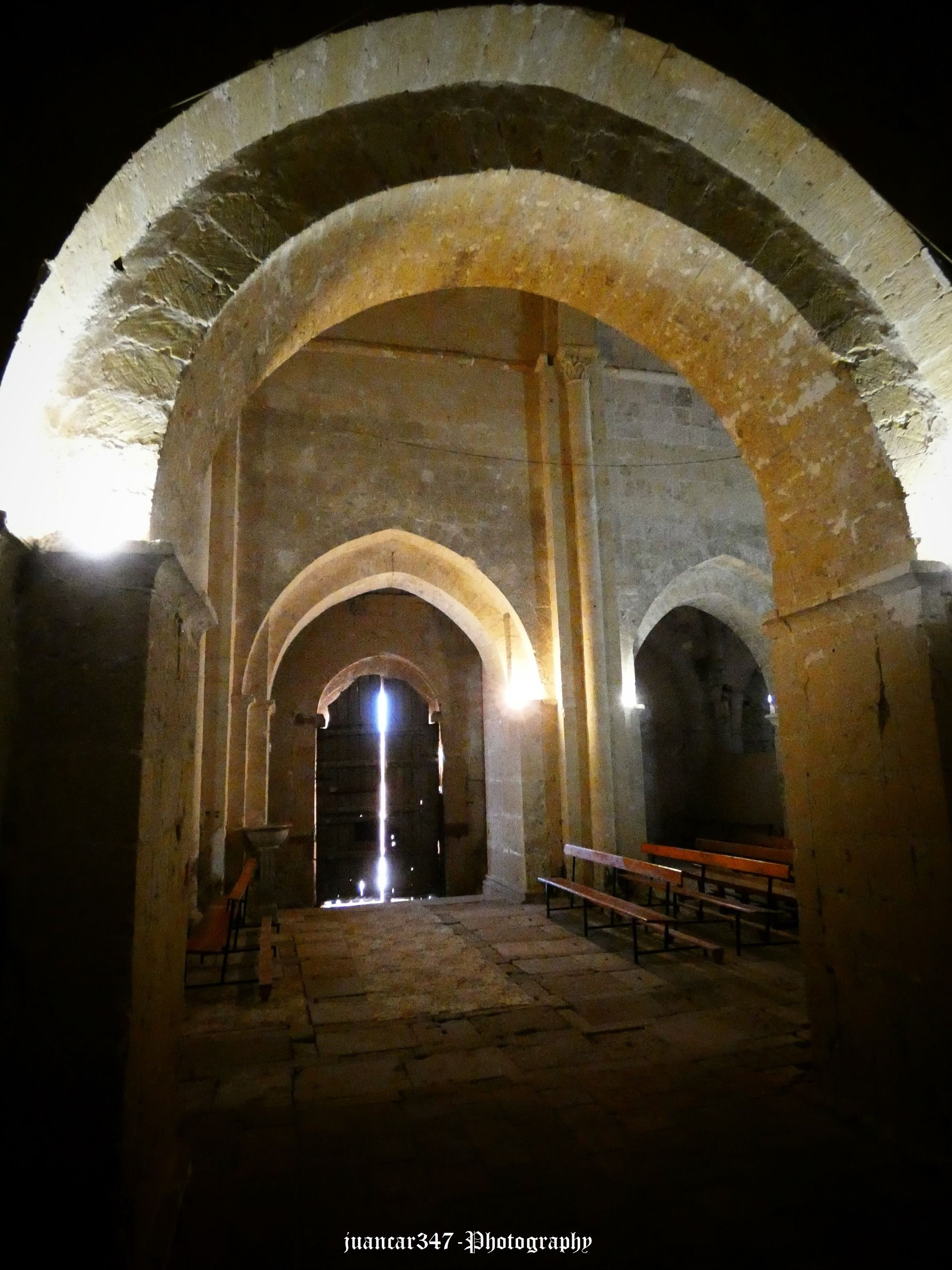 Barely a glimmer of light comes in through the old door