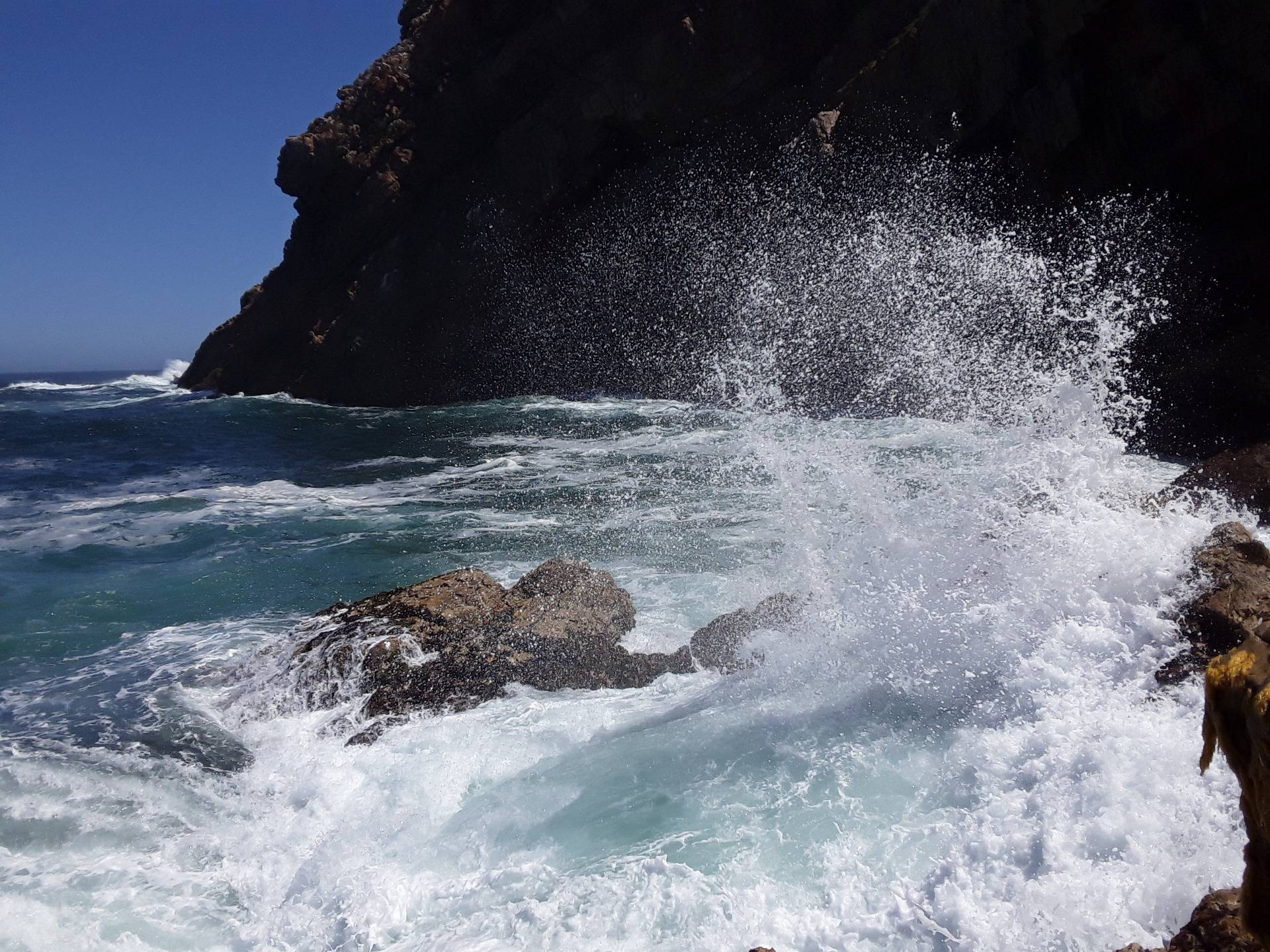fierce waves blocking the cave entrance today