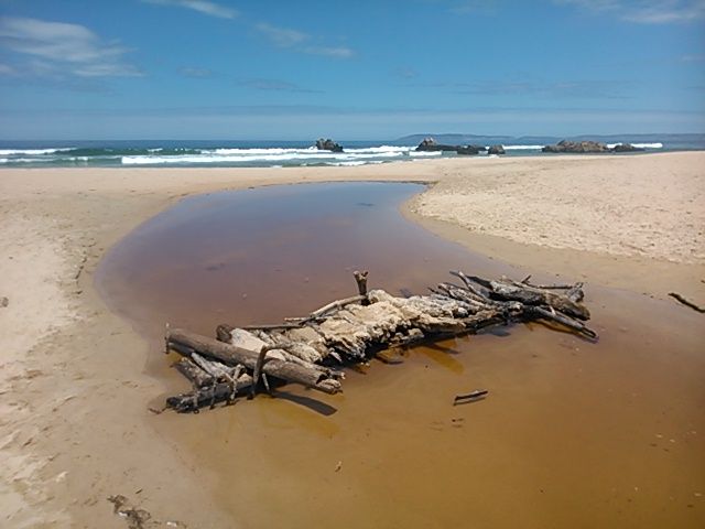 The same bridge from the other angle, crossing the little stream that flows to the sea