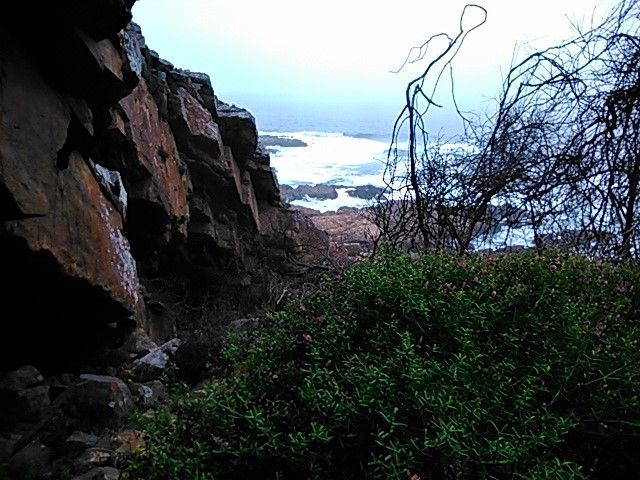 View from another meditation cave half way up the steep clops of the shoreline cliffs