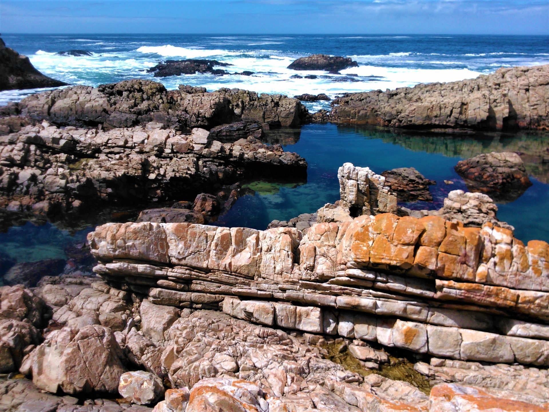 A place to explore for sea life while the Indian ocean is held back by the rocky wall, facing south.