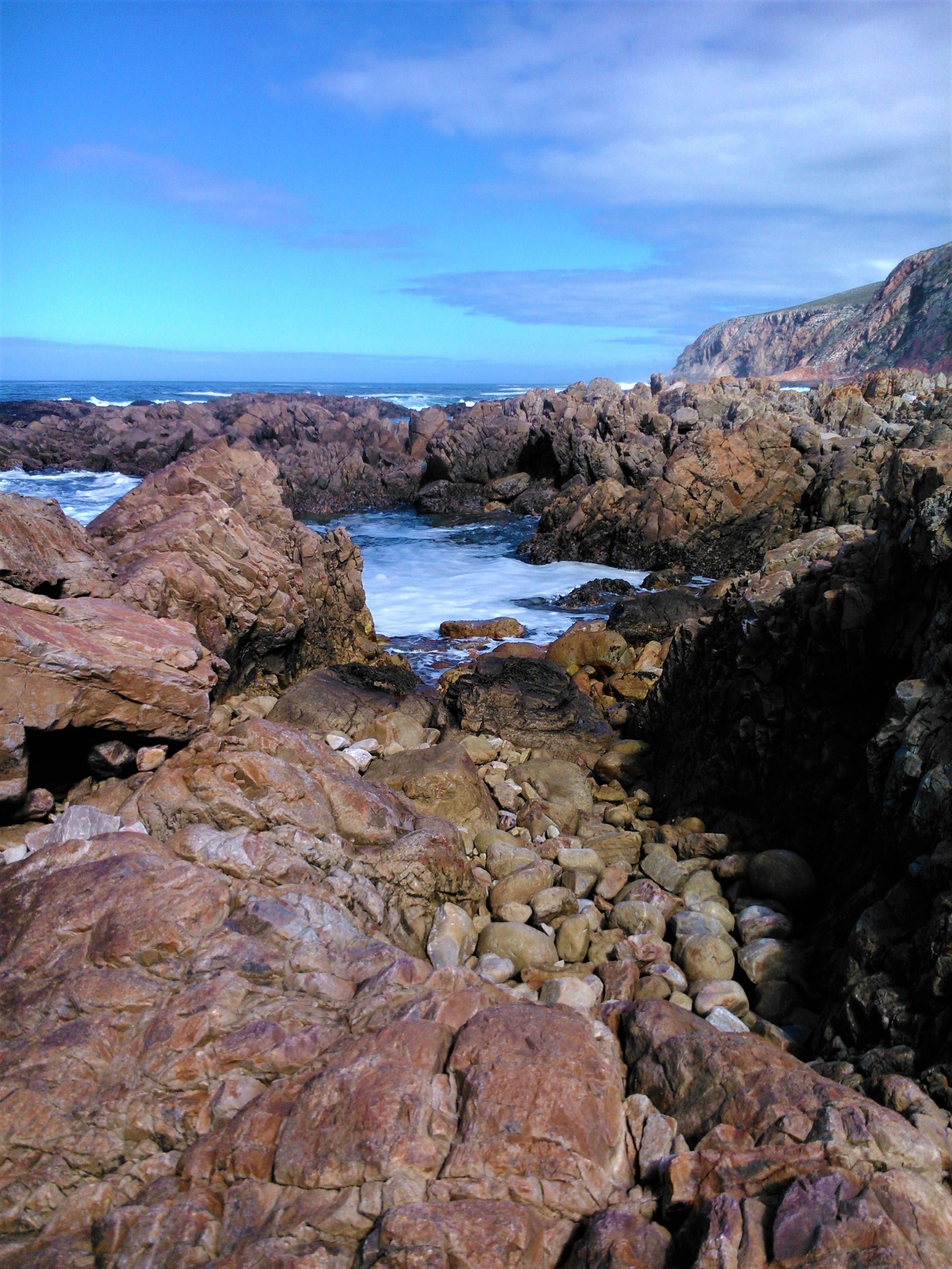 Exquisite ochre rock colors contrasted against the sky and sea so blue.
